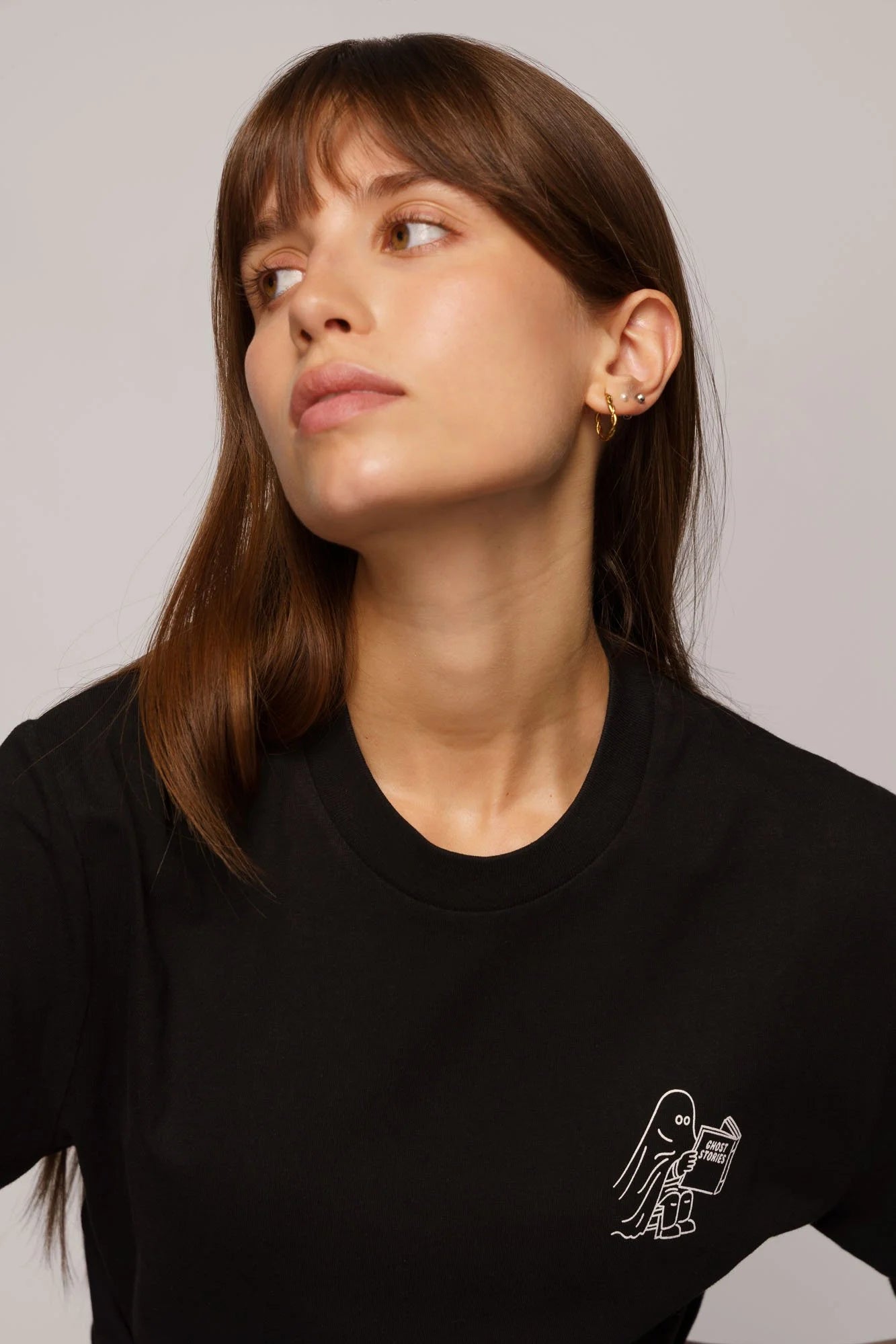 Contrast graphic tees designer edition Ghost Stories, sustainable organic t-shirt with creative artwork.