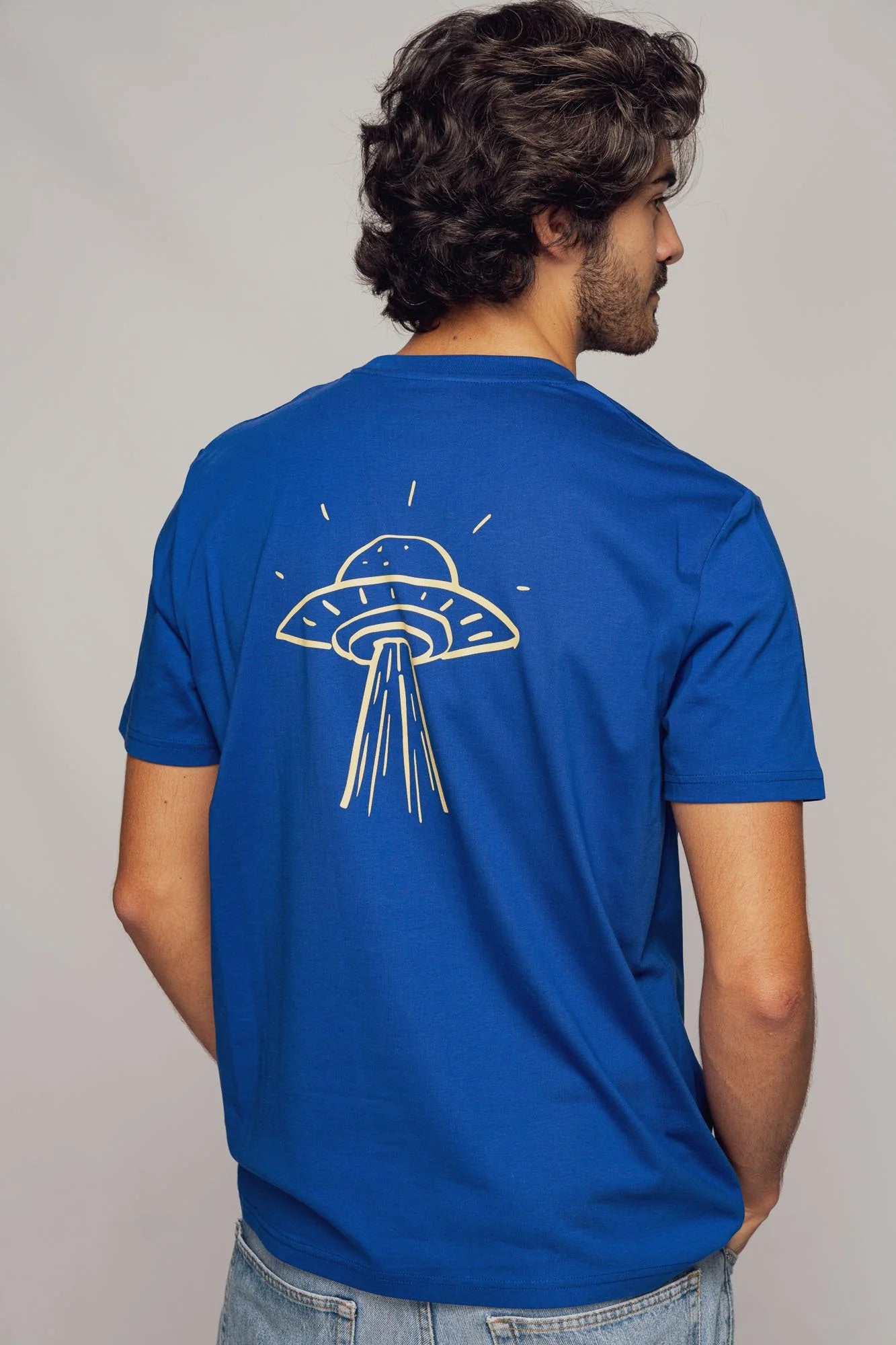 Organic tee shirts by Contrast, Take Me Home t-shirt graphic design with playful abduction artwork.