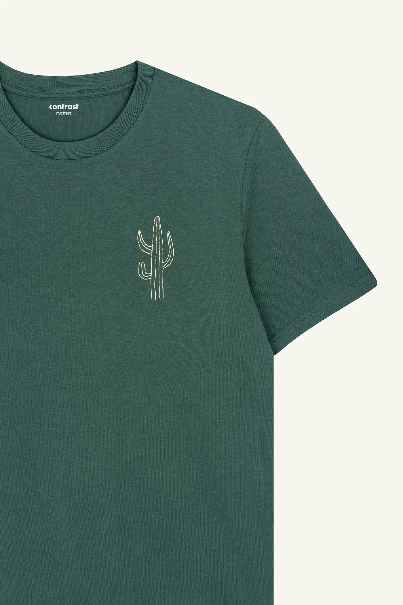 Contrast designer graphic tees collection featuring Cactus organic t-shirt in bold Green Bay shade.