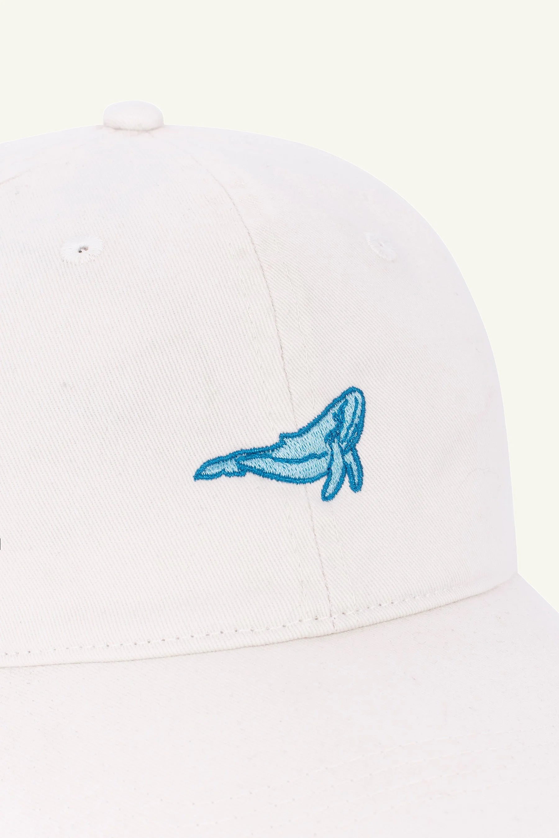Sustainable embroidered hat, Contrast Jumping Whale design in organic cotton Washed Ivory cap