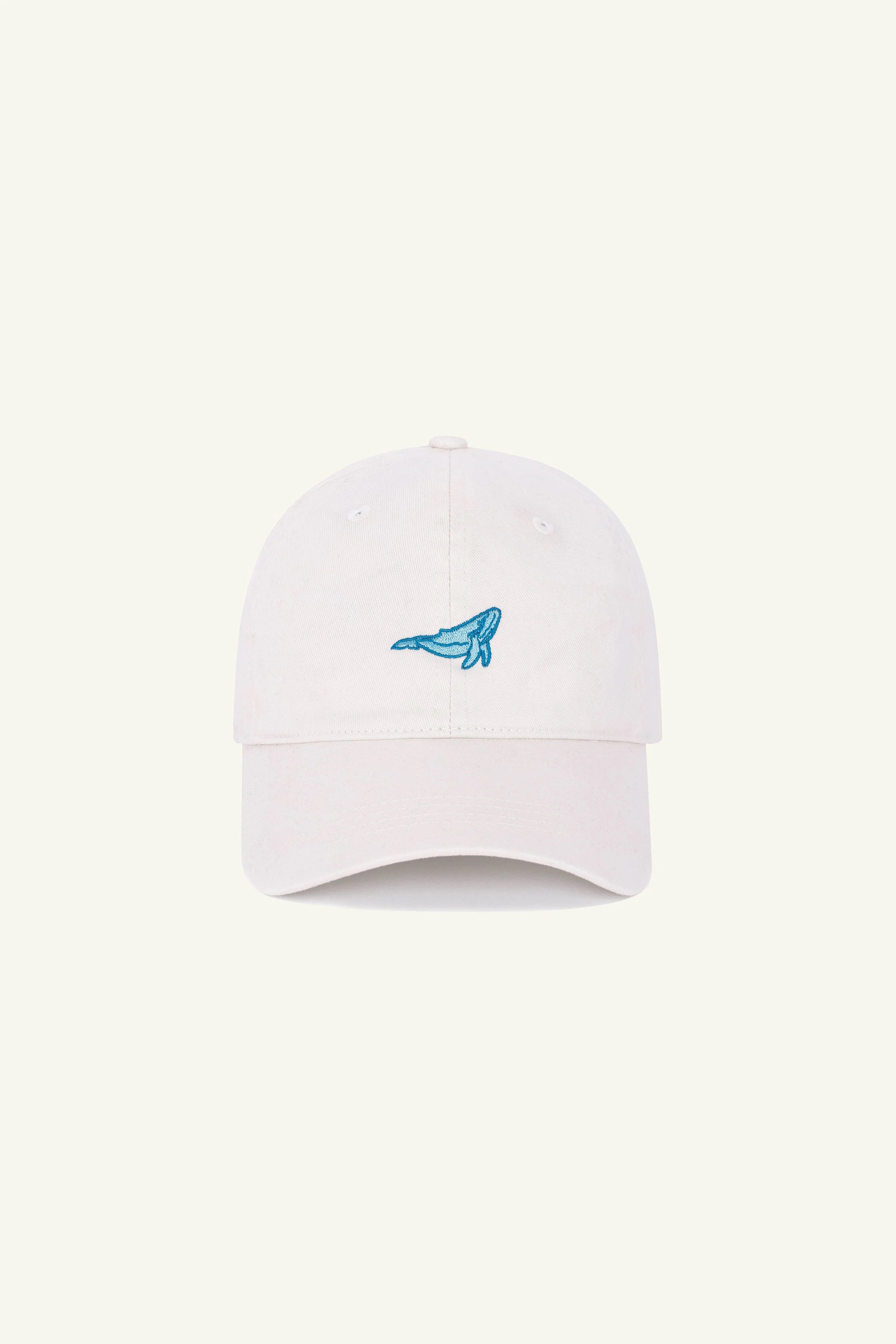 Contrast Jumping Whale embroidered hat in Washed Ivory, organic cotton cap with subtle detail
