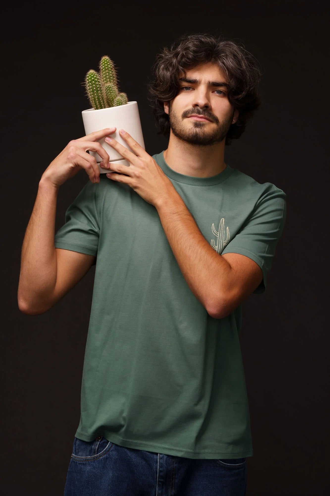 Organic tee shirts by Contrast, Cactus t-shirt graphic design on green base, stylish and sustainable.