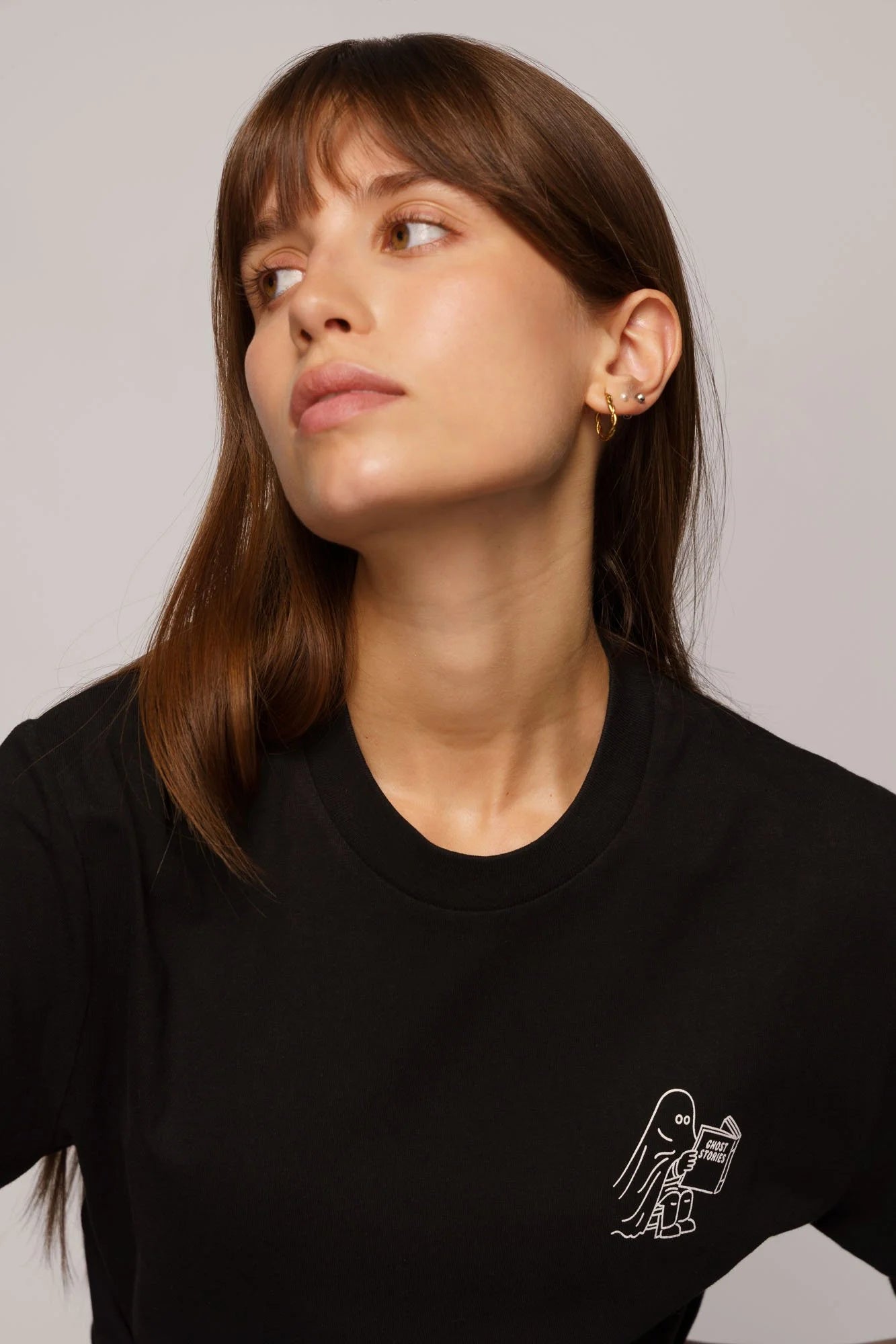 Contrast graphic tees designer edition Ghost Stories, sustainable organic t-shirt with creative artwork.